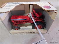 ERTL International cub model tractor.