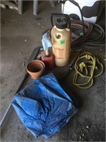 sprayer, gas can, clay pots, rope, tarp, oar