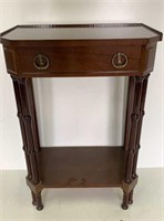 Small dark wood nightstand or foyer table