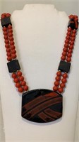 Orange and black bead necklace