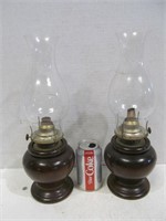 Pair of oil lamps in wood holders