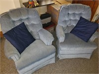 Two swivel rocker chairs