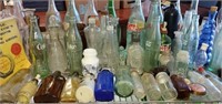 Shelf of Vintage Glass Bottles, Coke Bottles Etc