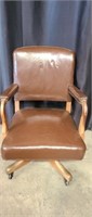 Beautiful leather and wood roll around chair