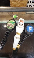Three unique beer tap handles