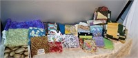 Lot of fabric and quilting squares, some quarters