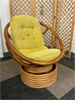 Rattan Swivel Rocker Chair w/ Yellow Cushion.