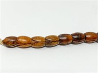 Carved Koa wood Pikake bracelet