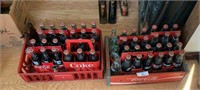 Two Coca-Cola Cases and Bottles