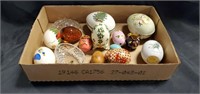 Decorative wooden and porcelain eggs and holders