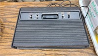 Vintage Atari council with games and controllers