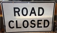 Huge steel road closed sign