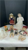 3 Porcelain dolls and 2 stuffed dolls
