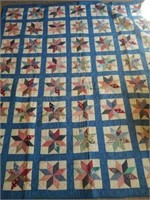 Handmade Eight Point Star Quilt has A stain