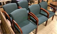Five matching office chairs, with a solid teal