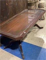 Vintage glass top coffee table with claw feet
