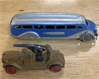 Vintage Greyhound bus tin toy with rubber wheels