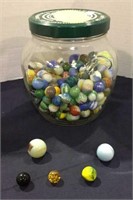 Marbles, half full jar of marbles, different sizes