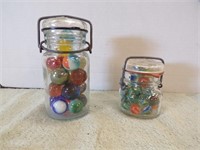 JAR OF SHOOTER MARBLES & JAR OF CAT'S EYE MARBLES