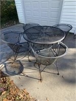 Wrought iron patio table and four chairs