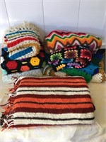 Different size handmade afghans, 8 total.