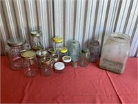 Glass jars & bottom half of a butter churn.