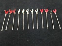 Group of silver plated rooster olive picks