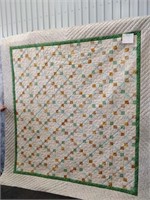 Nine Patch green and beige pieced quilt