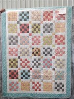 16 patch pieced quilt