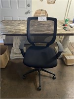 Black office chair with mesh back