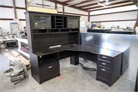 Black L shaped desk with bookcase top