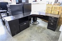 Black L shaped desk with filing cabinet