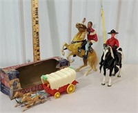 box of toys including covered wagon and horses
