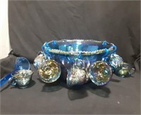 Blue carnival glass punch bowl with 12 cups an