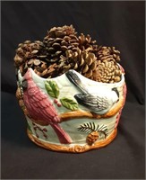 Decorative bird bowl with pinecones