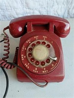 Red landline rotary dial telephone