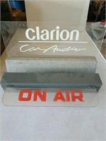 ON AIR sign and Clarion advertising
