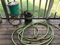 Metal foot stool, garden hose, 5 gallon shopVac