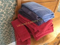 many plush red/ blue bath towels hand wash cloths