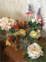 assorted realistic looking floral displays vases