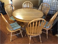 Oak dining room table with 6 chairs, 4 matching