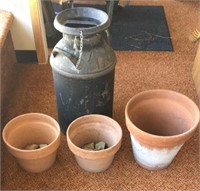 Large milk can and clay planter pots
