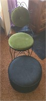 Black metal chair with green cushion and black