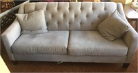 "Silver pine" (gray) colored sofa with pillows