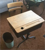 Old school desk with chair and garbage can