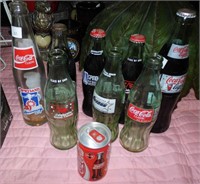 Lot of 9 Collectible Coca Cola Bottles/Can