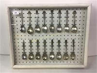 Hanging case with 16 silver plate spoons