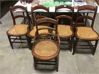 4 matching cane seat dining chairs, plus an orphan