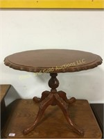 Oval scalloped edge table