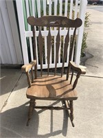 Rocking chair with barn painting on top
